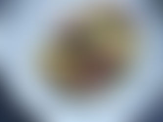 Poached pears, chicory, croutons, red onion and whipped feta cream are assembled in a salad.