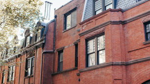 Charming historic urban street with classic red brick facades.