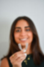 Max retainer employee smiling with max retainer product