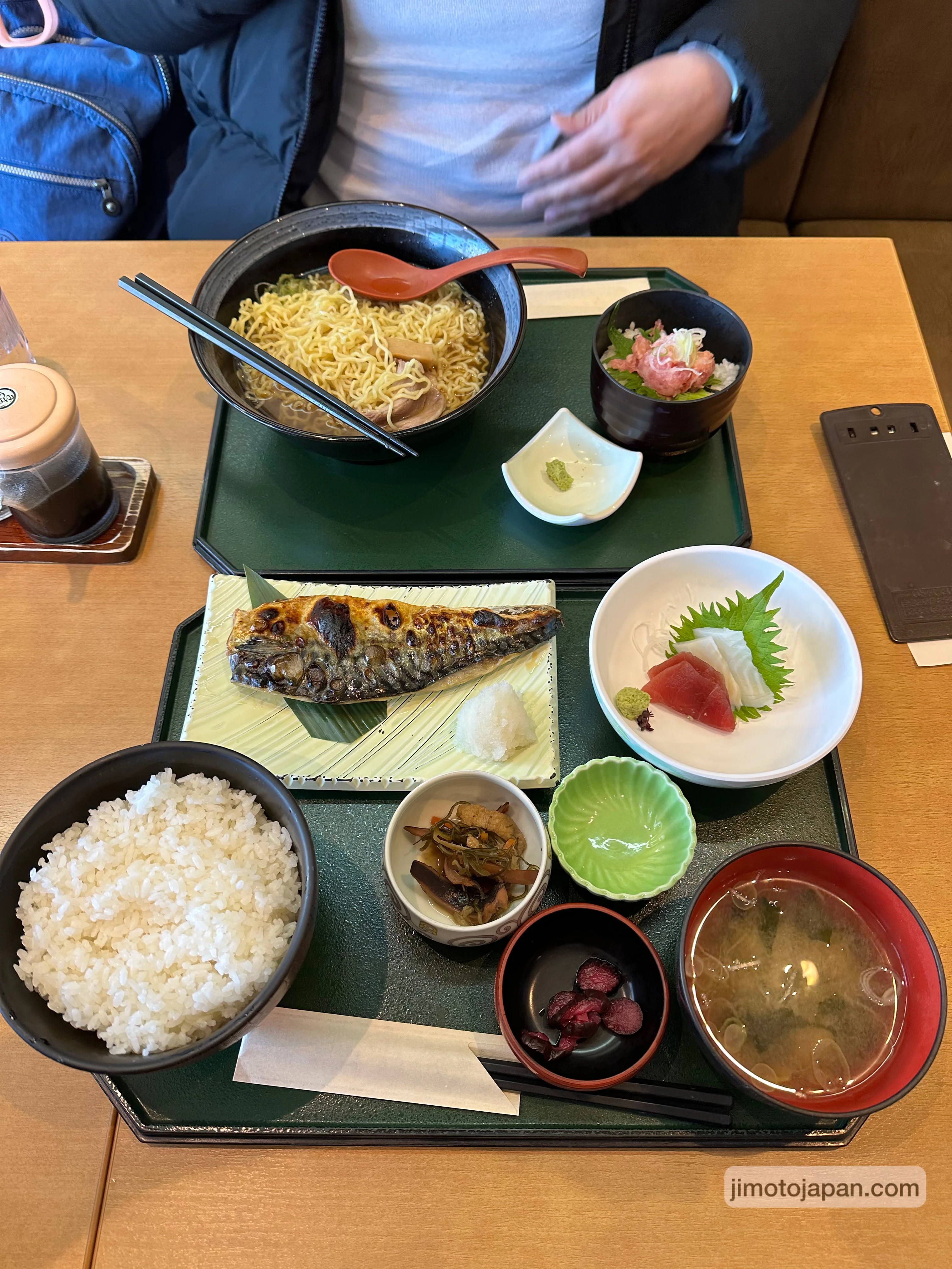 Affordable Japanese set meal with rice, soup, fish, and side dishes at a local restaurant