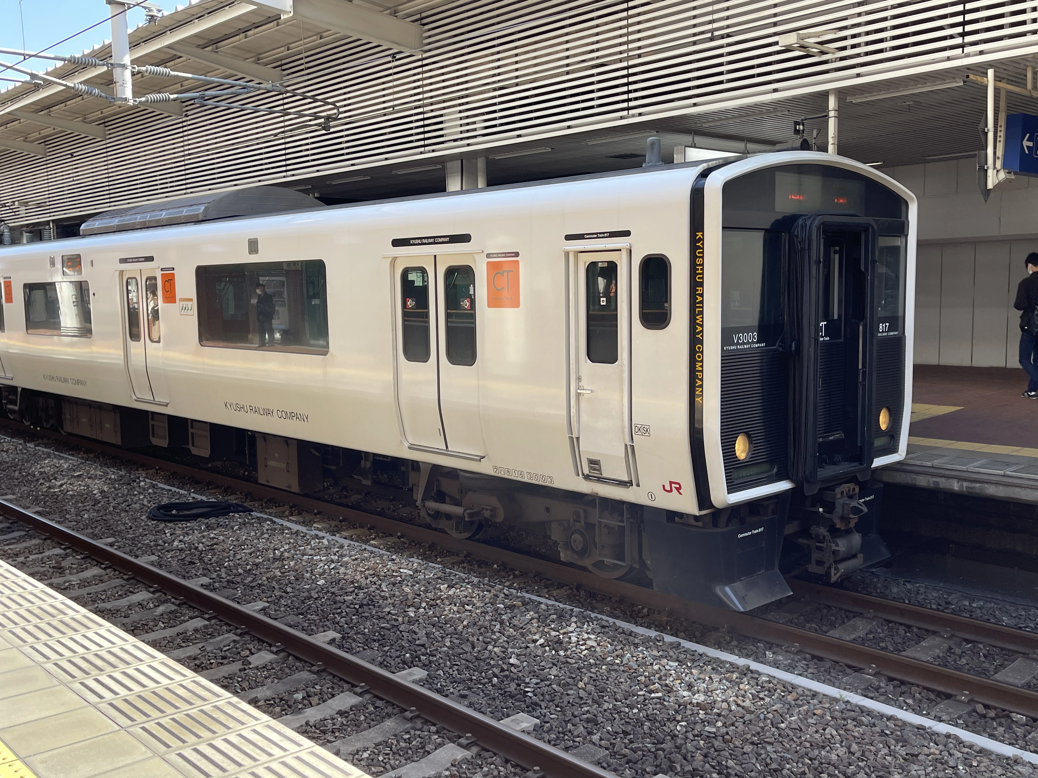 Regional train in Japan at a station platform, showing everyday public transportation commonly paid with IC cards or cash