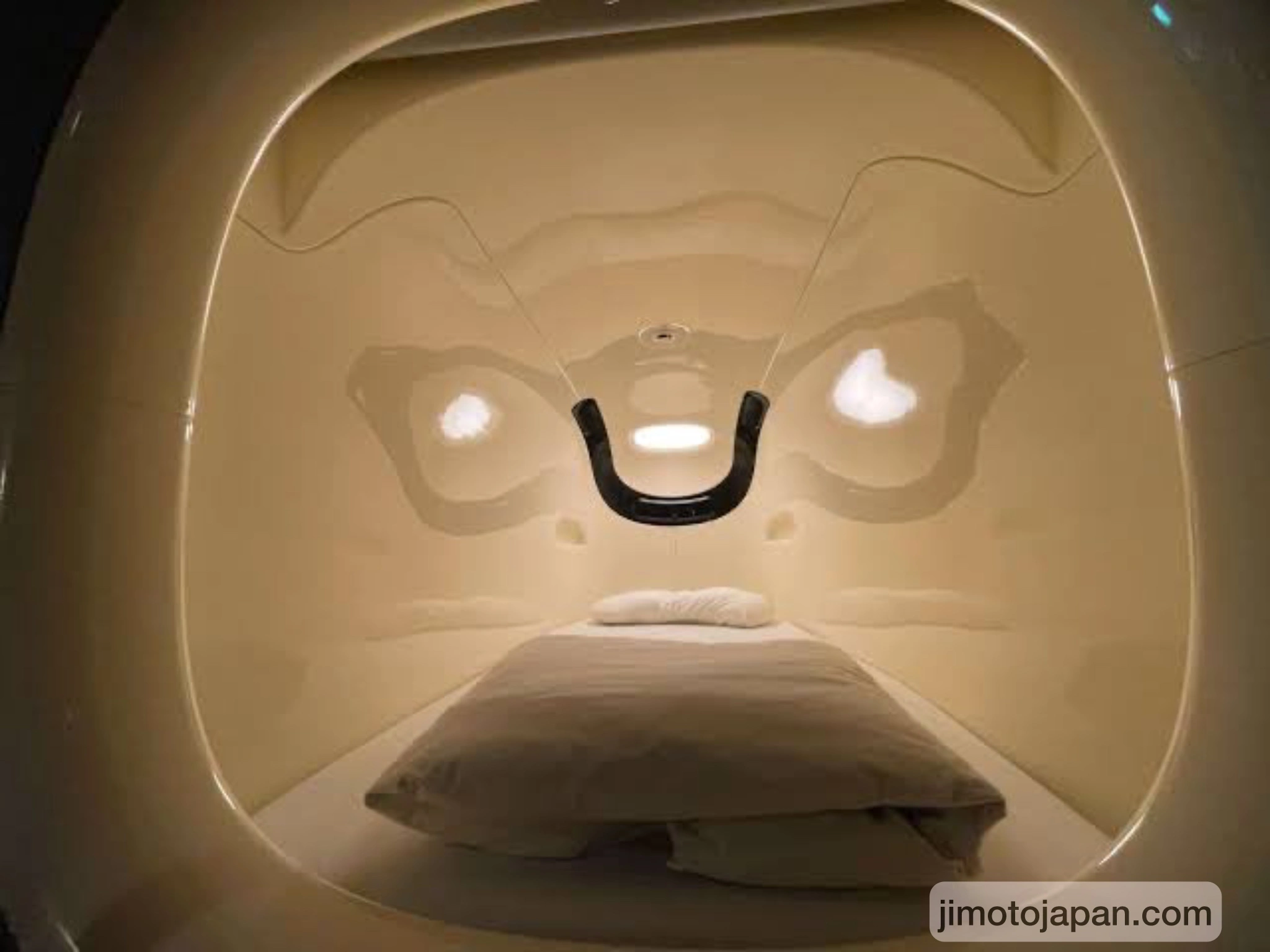 Interior of a capsule hotel pod in Japan, showing a unique and affordable place to stay