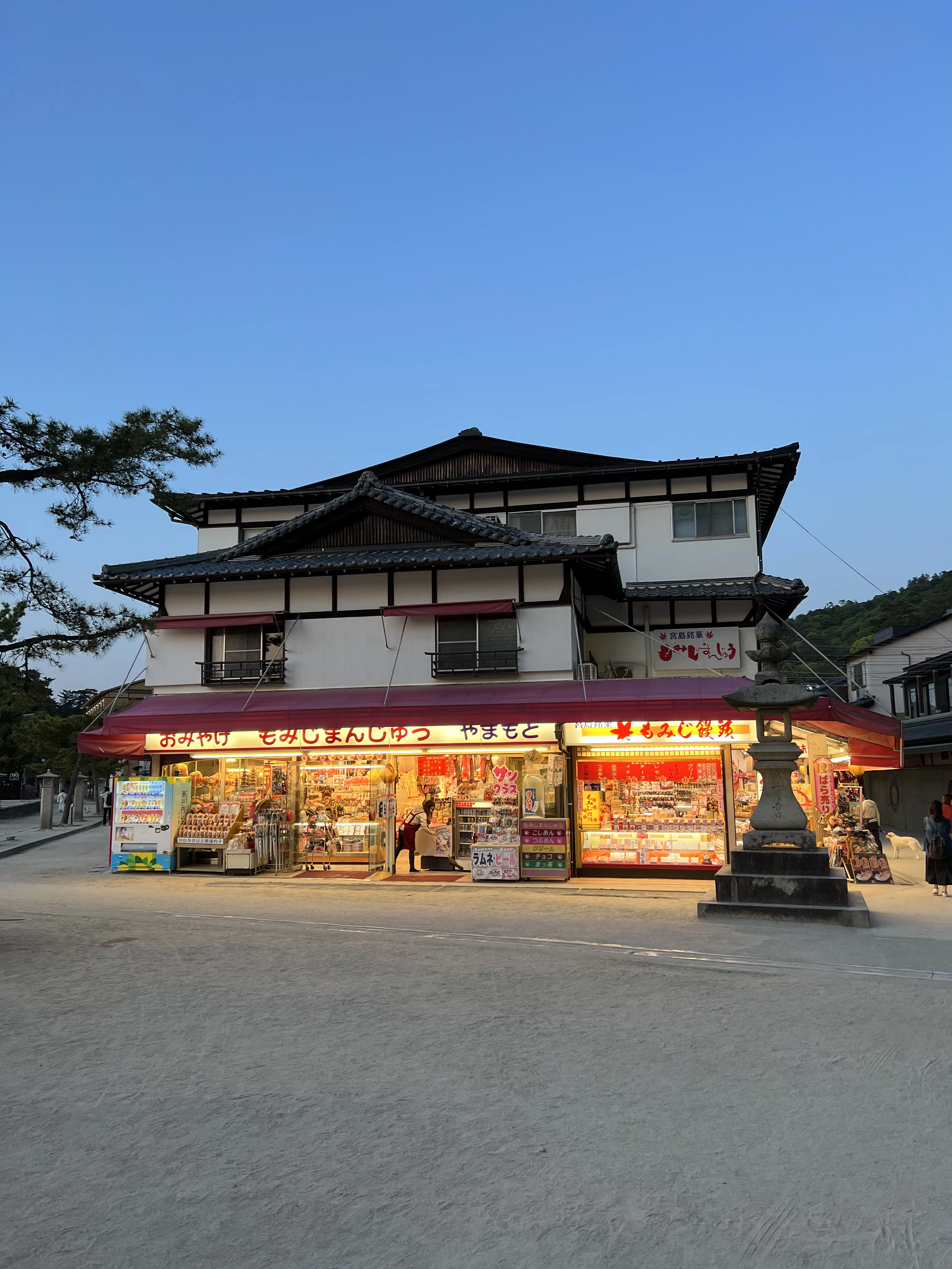 Traditional souvenir shop in Japan near a temple area, showing local stores where small purchases are often paid in cash