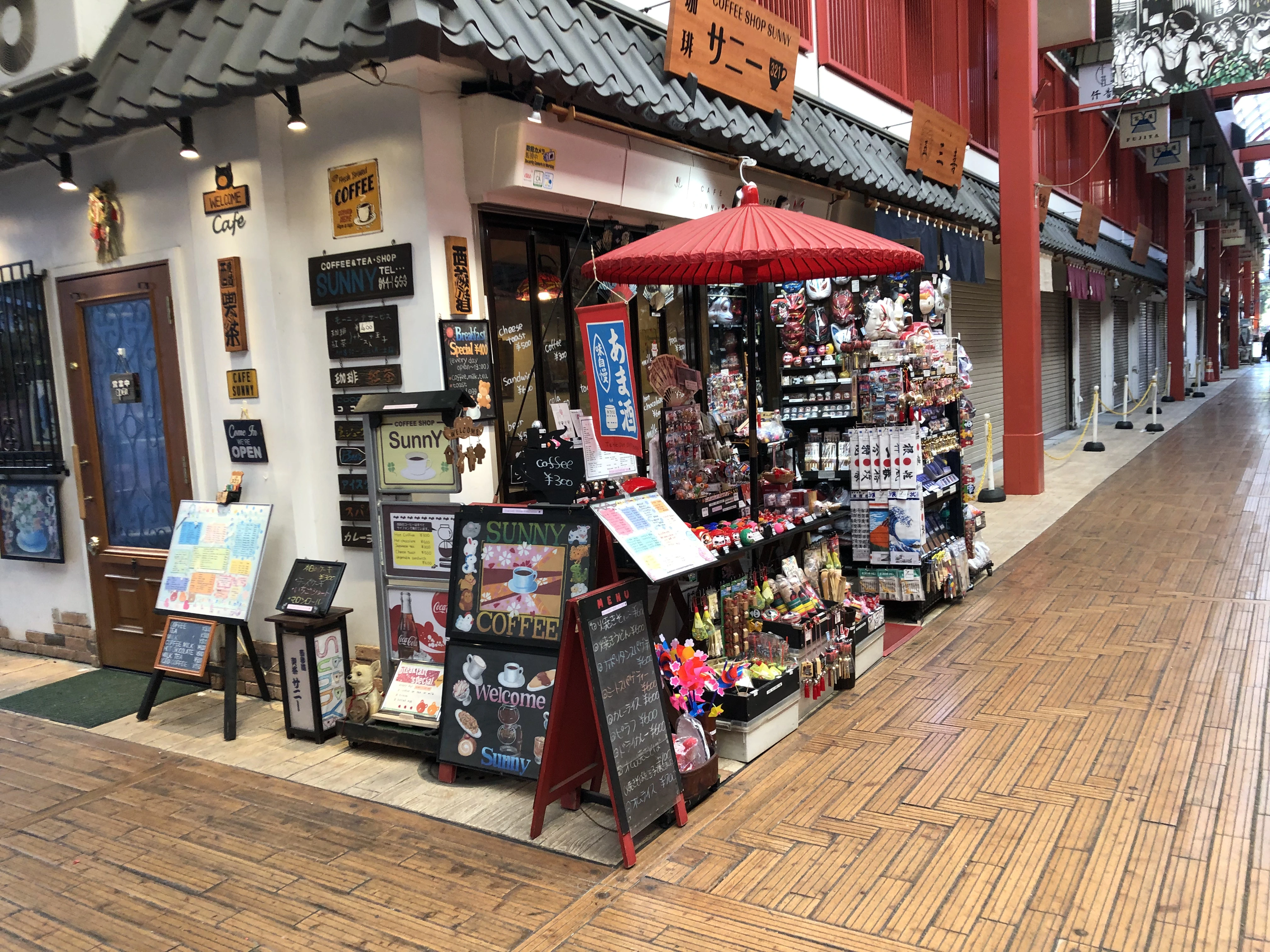 Traditional souvenir shop in Japan near a temple area, showing local stores where small purchases are often paid in cash