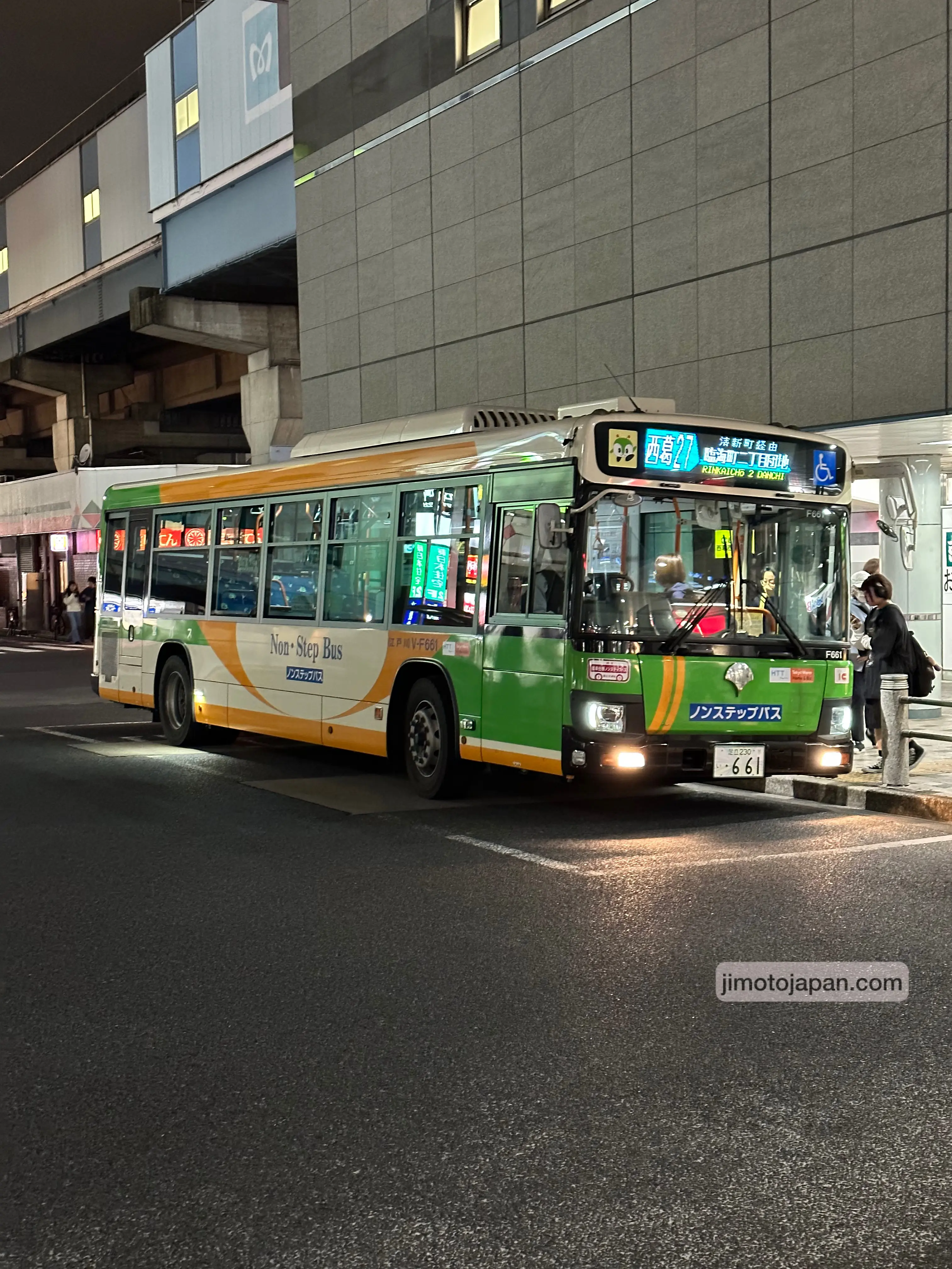 Modern city bus in Japan at night, showing accessible and affordable public transportation