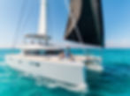 Lagoon 52 premium catamaran sailing in the San Blas Islands during a Christmas charter, offering luxury comfort, turquoise waters, and a tropical holiday experience.