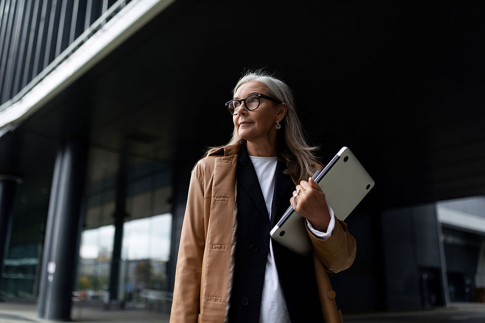 elderly-successful-business-woman-against-backdrop-facade-office-center-revert.jpg