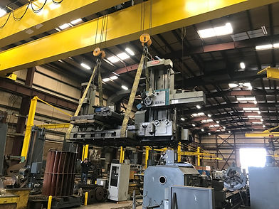 Overhead crane lifting heavy machinery