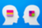 Two white silhouette profiles face each other on a blue background. Each has colorful blocks on their heads, creating a thought-provoking design.