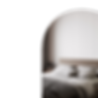 Calm bedroom view through arched doorway