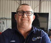Headshot of James Gale, managing director, standing in the workshop