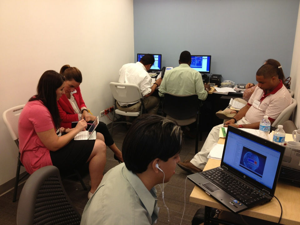Christy Slanaker in a workshop room training new employees in Pafrom a onboarding program she created in Spanish