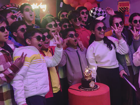 Kids enjoying cake cutting at the best Birthday party Venue The Pink Falcon in Jaipur