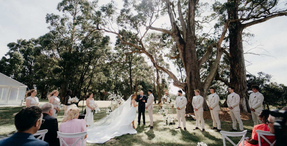 Couple’s outdoor wedding under the Grand Tree at Leonards Hill Estate, a scenic Daylesford wedding venue surrounded by countryside views.