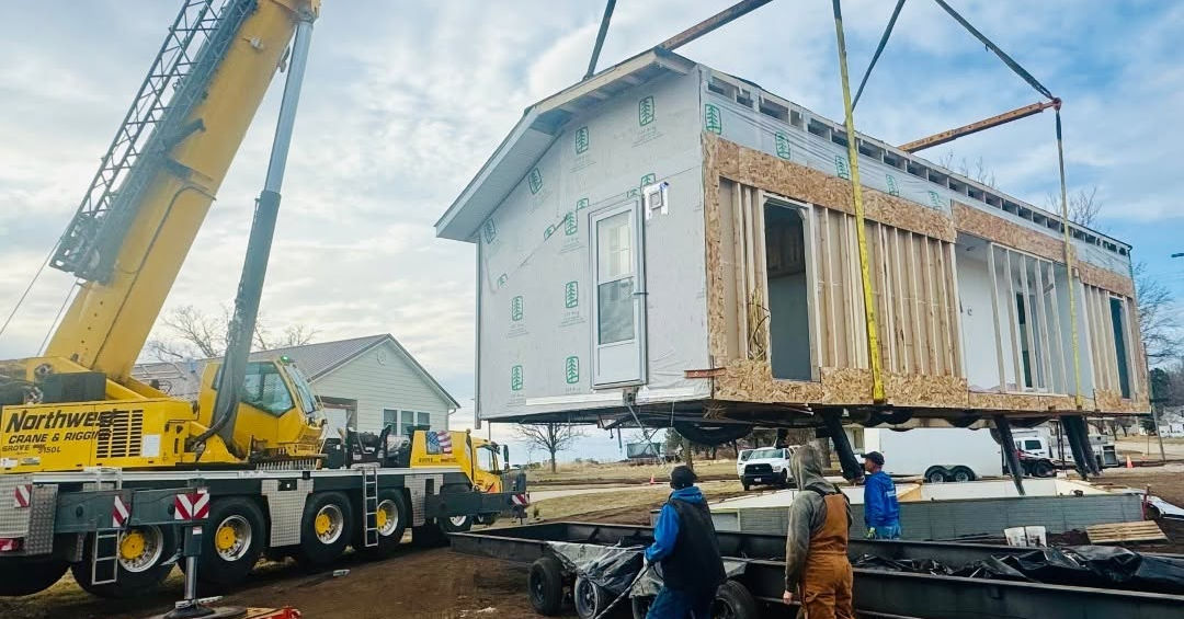 Crane picking portion of a home addition