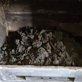 rocks of creosote in log burner