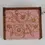 Thumbnail: Top-view close-up of a pink wooden music box featuring intricate floral engravings.