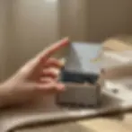 Top-down view of a pastel blue wooden music box engraved with "Love you to the moon and back" message and a moon.