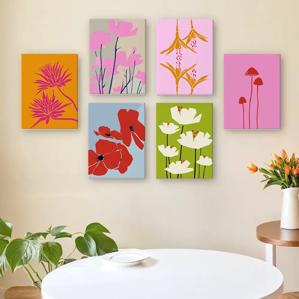 A colourful wall featuring 6 completed floral paint by numbers canvases hung in a living room.