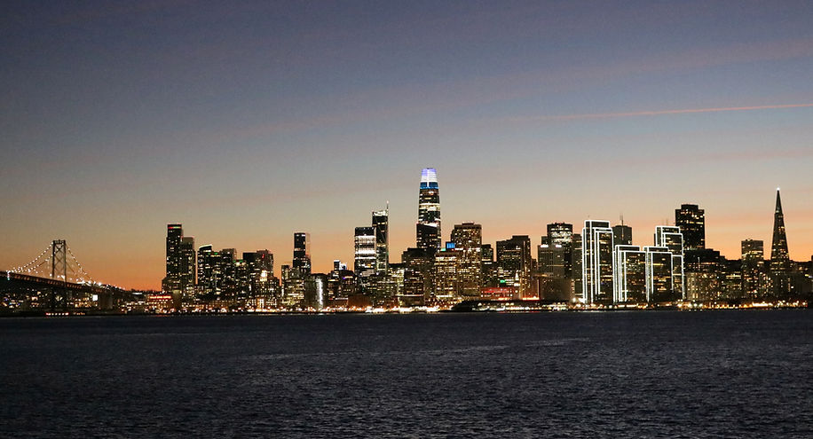 San Francisco skyline at Christmas with building lit and Bay Bridge by Peter Keresztury