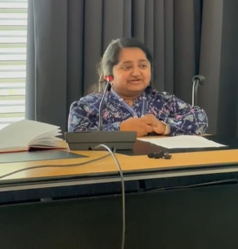Niveda speaking at an event