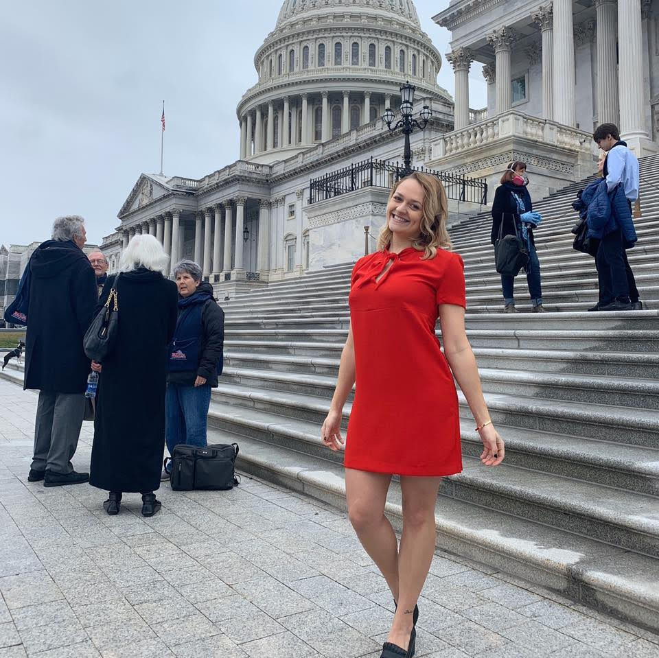 Taylor wearing red dress outside capitol building Washington DC