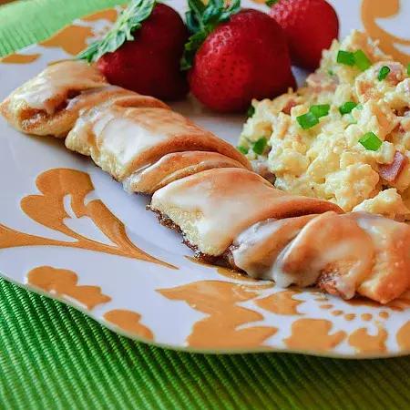 Golden cinnamon crescent roll twists with glaze
