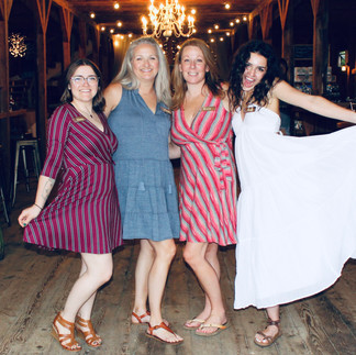 PBF team in the barn store. Ashley, Missy, Kris and Alina all wearing pretty dresses and smiling