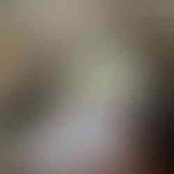 A lovely sitting area with a balcony overlooking the water.