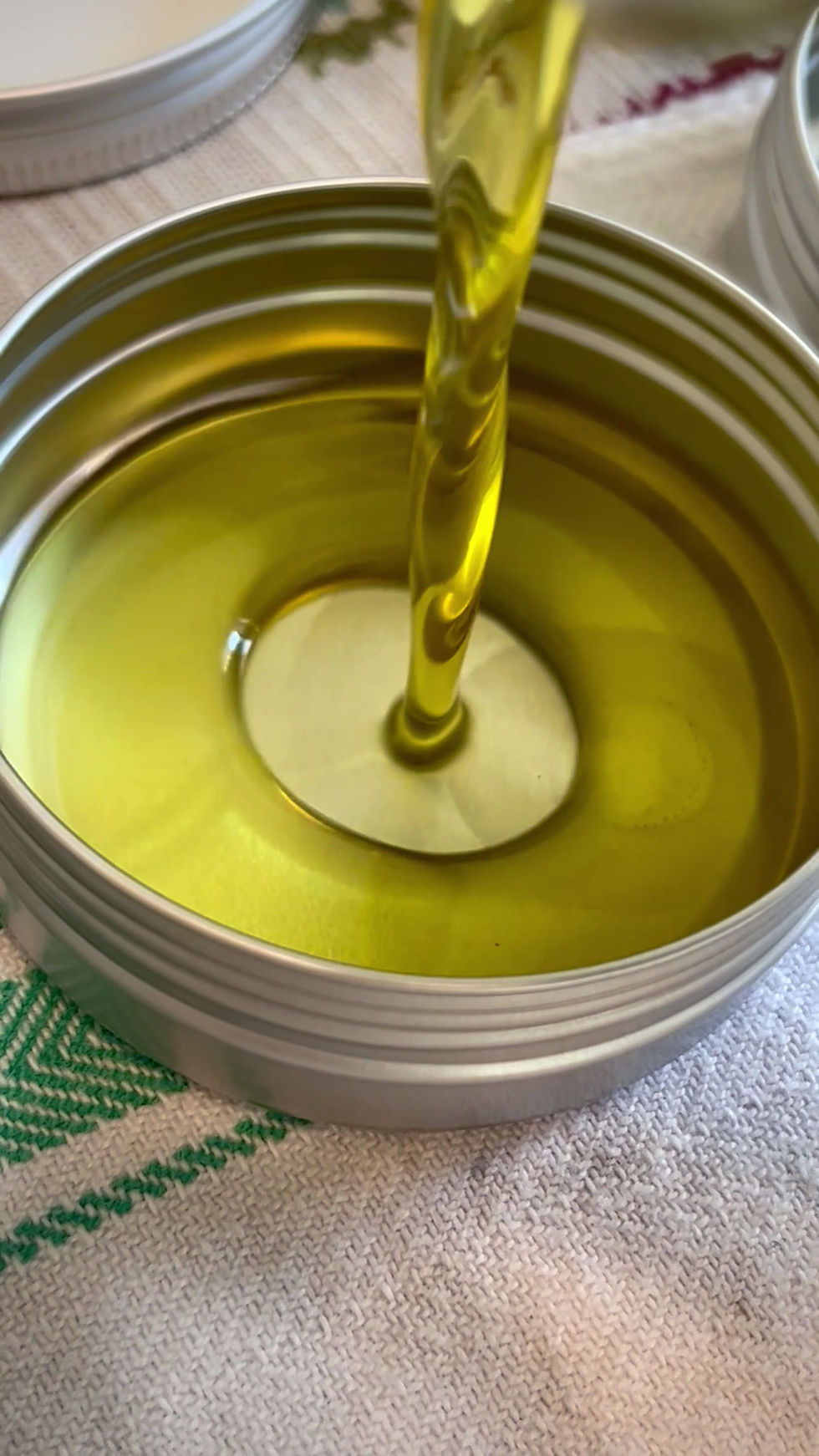 Thumbnail: Pour scene of Healing Earth Wellspring Balm showing rich and warm texture-pour before cooling in tin