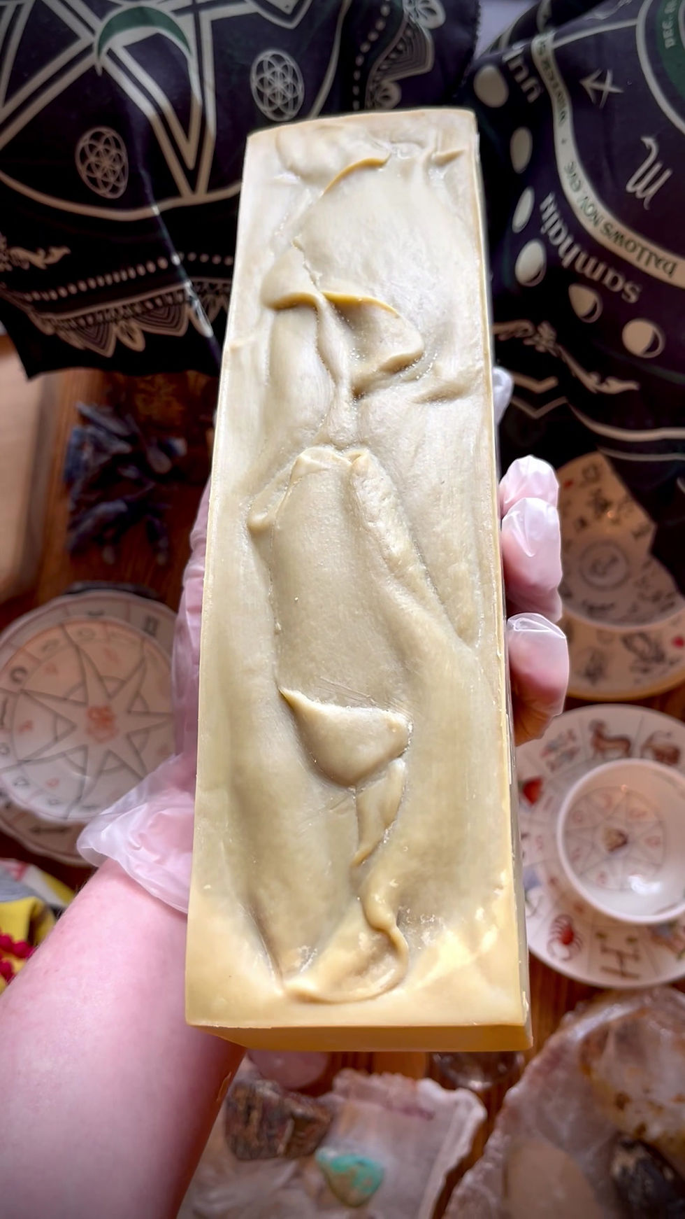 Thumbnail: Top view of freshly unmolded Laurel Olive Oil Aleppo Soap loaf in-hand detailing rich textured top