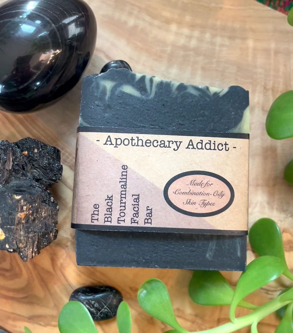 Thumbnail: Black Tourmaline Facial Cleansing Soap Bar in labeled packaging styled with calming botanical elements