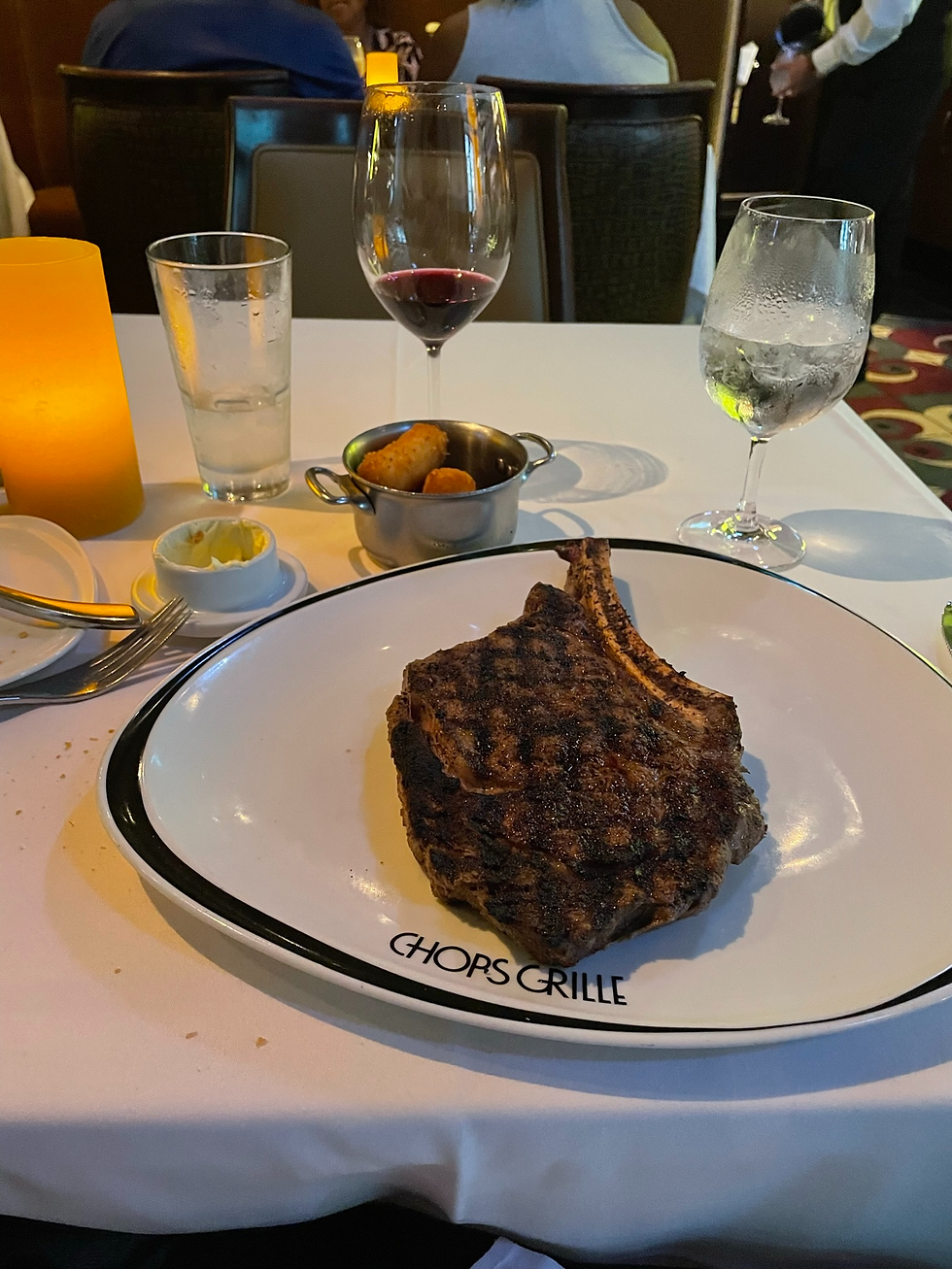 The Prime Bone-In Ribeye served with Gruyere Cheese Tater Tots
