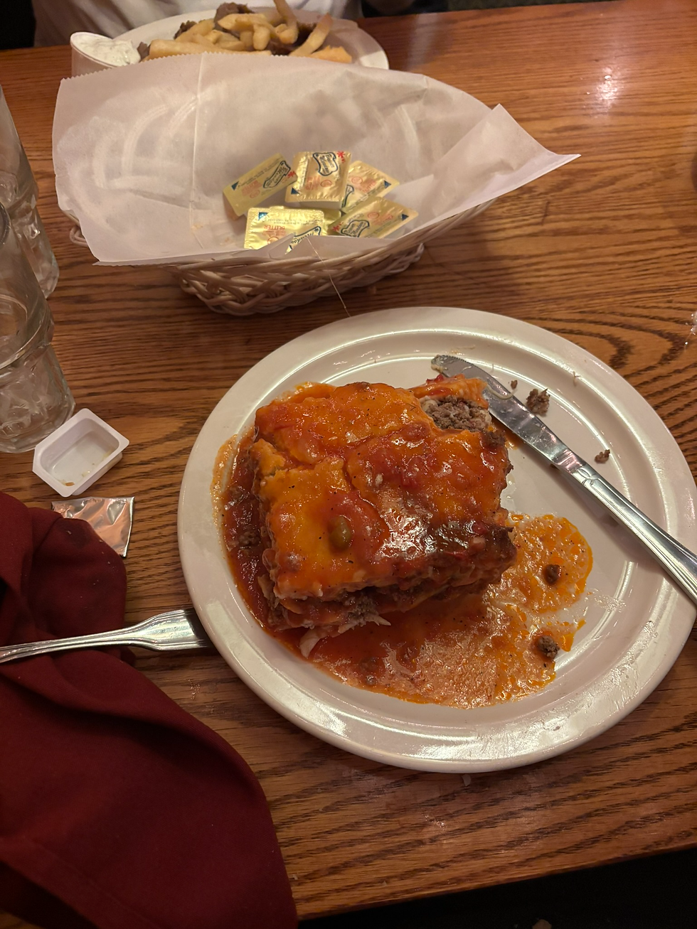 The Pastitsio, a unique Greek comfort dish that essentially serves as the Mediterranean cousin to lasagna, layering tubular macaroni and seasoned ground meat under a thick, golden cap of rich béchamel sauce.