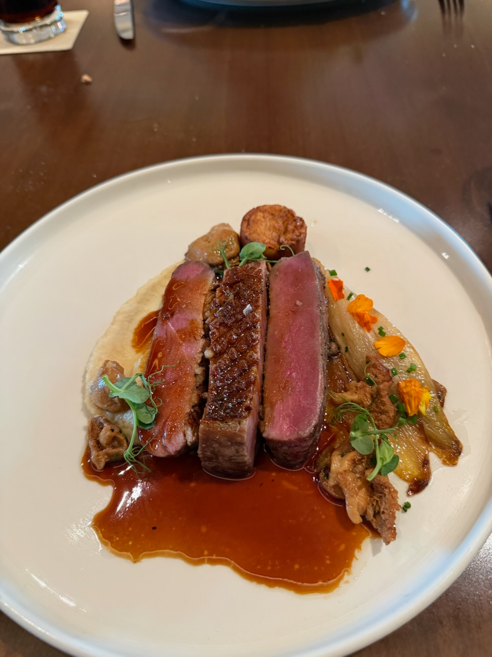 Duck à l'Orange - Escarole, Chicken Jus, Lemon Vinaigrette, Fingerling Potatoes, and Heirloom Tomatoes