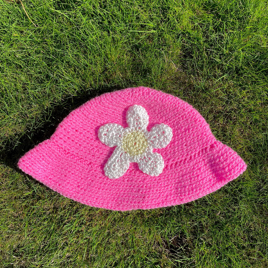 Hand made crochet pink bucket hat with white daisy on front made in Scotland