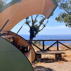 Making coffee in an outdoor kitchen of a mini caravan