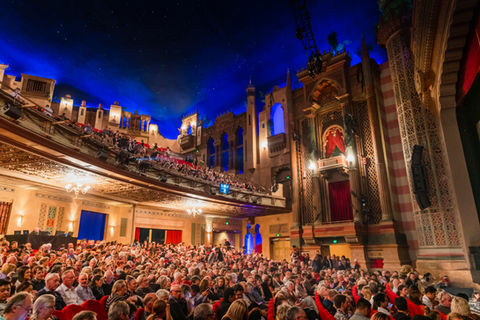 Inside The Civic Theatre in Auckland with people sat down waiting for a show to start.jpg