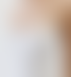 Wedding dress with pointed strapless neckline and floral beaded lace