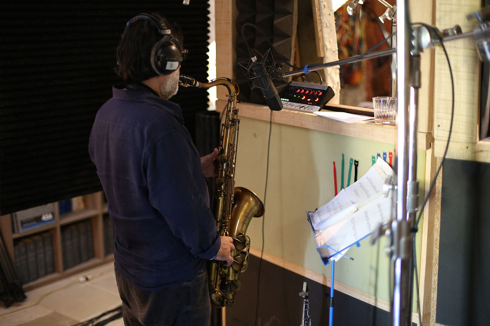 Pericle Odierna playing the saxophone in the live room at Nightingale Studios.