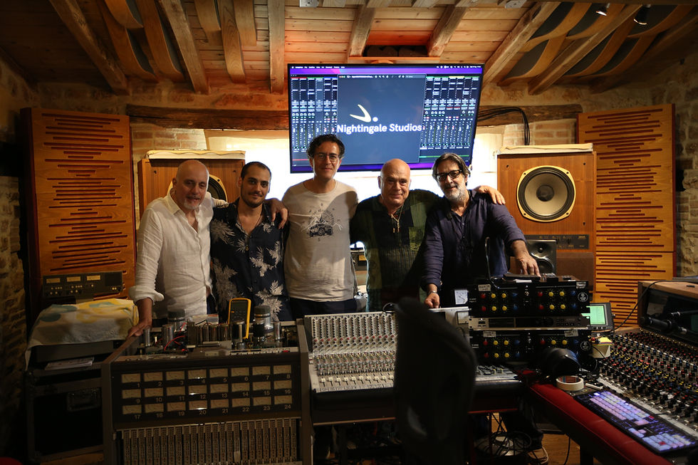Maestros Armando Bertozzi, Pericle Odierna, and Lello Petrarca together in front of the analog mixing console at Bird Box Records' Nightingale Studios.