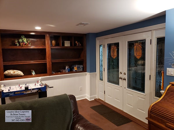 Finished basement with new custom designed built in cabinets with shelving, new custom chair rail and bead board wainscoting 