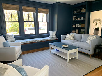 South shore interior designer open floor plan dark blue and white coastal living room