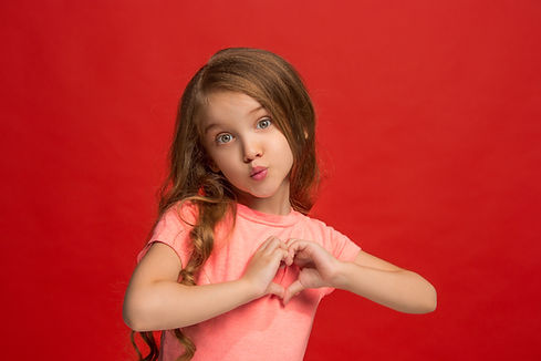 young-girl-sending-kiss-making-heart-sign-with-hands.jpg