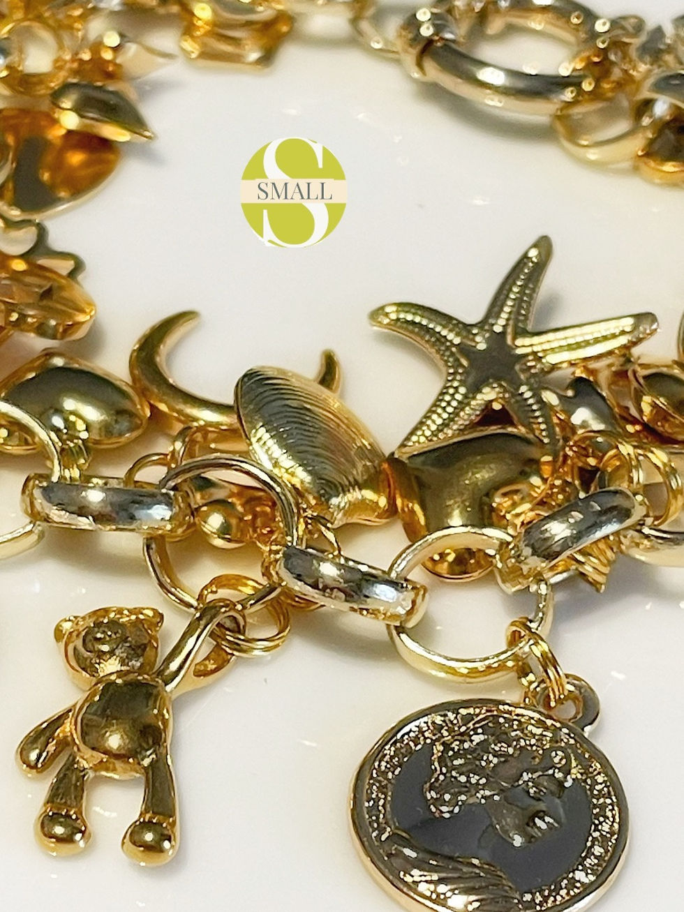 Miniatura: Bracciale con charms dorati