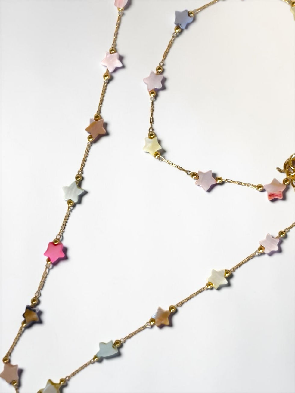 Miniatura: Collana lunga stelle in madreperla, colori pastello