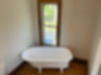 Clawfoot bathtub after being refinished to white