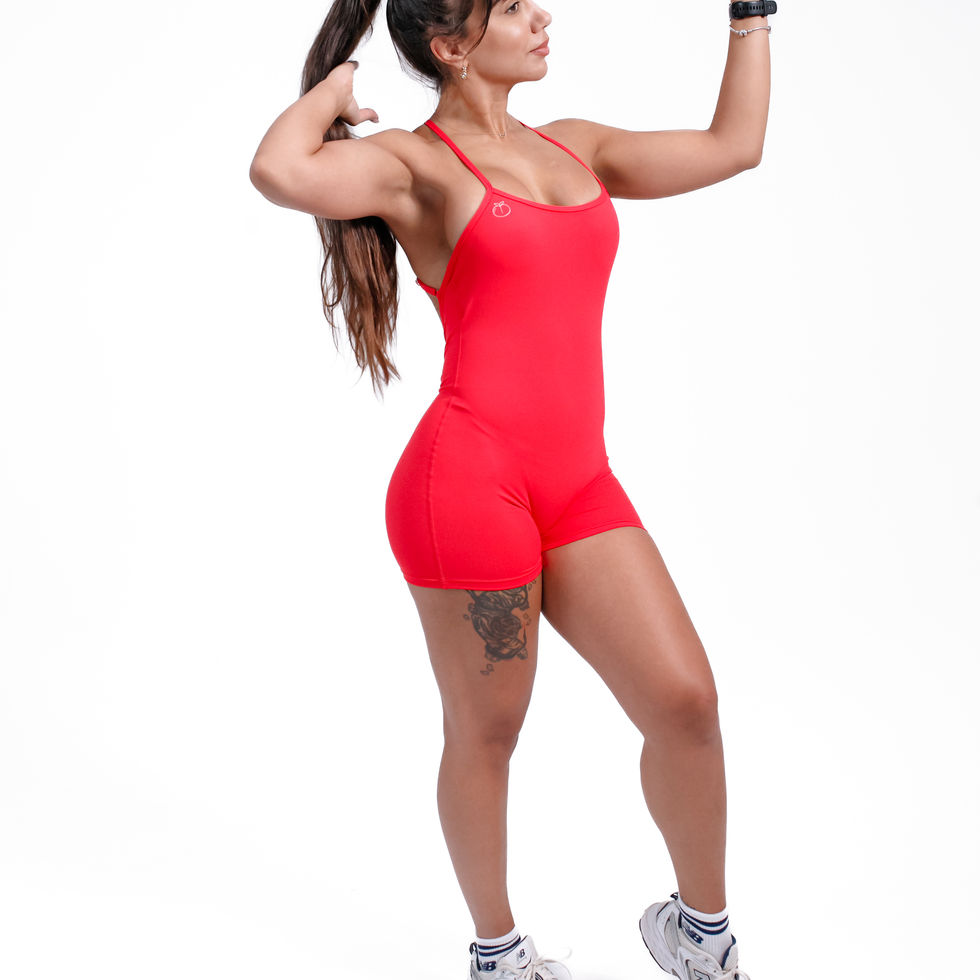 Front view of model wearing red open-back BÜNDA BUTT one-piece activewear set – Back On Fire
