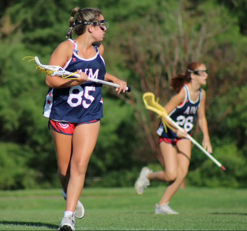 Female lacrosse players practicing on-field movement patterns during game play, illustrating efficient hip and shoulder sequencing to improve shot speed and power.