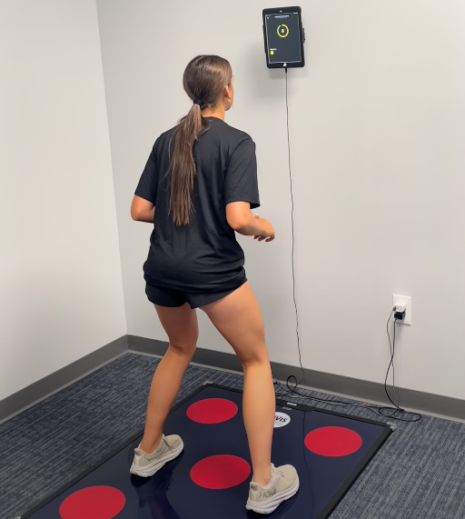 Athlete performing Quick Board reaction drills at Analytics for Athletes to convert film recognition into faster defensive responses for lacrosse.